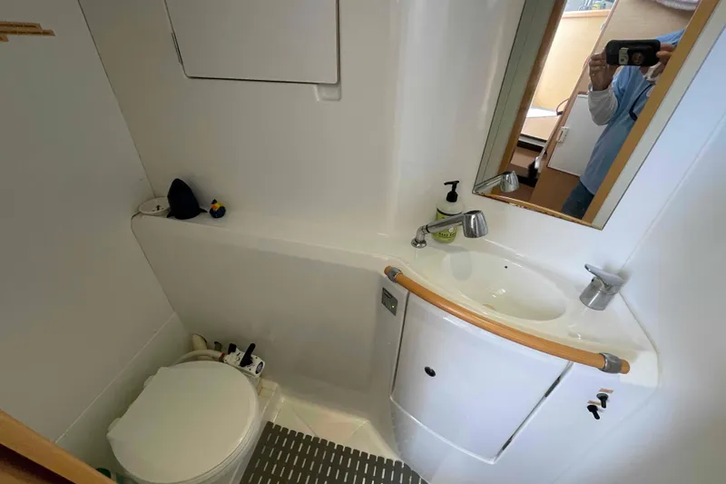 Apres-sea Yacht Photos Pics Bathroom interior of 2012 Lagoon 380 S2 yacht with sink and toilet.
