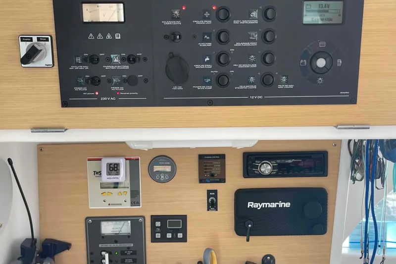 Apres-sea Yacht Photos Pics Control panel of a 2012 Lagoon 380 S2 yacht with navigation and electrical systems.