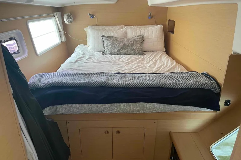 Apres-sea Yacht Photos Pics Cozy bedroom interior of 2012 Lagoon 380 S2 catamaran with comfortable bedding.