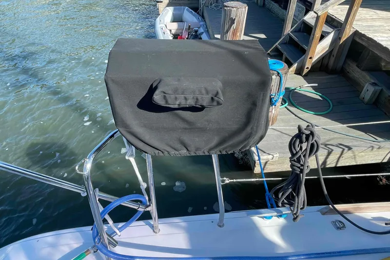 Apres-sea Yacht Photos Pics Covered equipment on Lagoon 380 S2 yacht, docked by wooden pier, 2012 model.