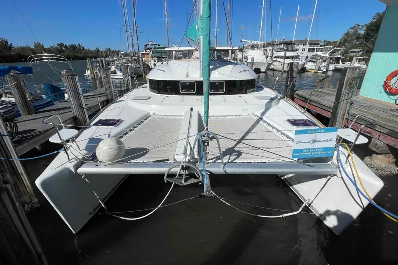 Apres-sea Yacht Photos Pics 2012 Lagoon 380 S2 catamaran docked at a marina, front view.