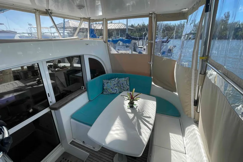 Apres-sea Yacht Photos Pics Interior of 2012 Lagoon 380 S2 catamaran with cozy seating and table.