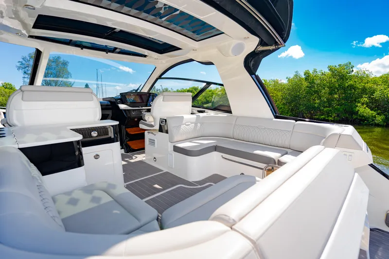  Yacht Photos Pics Luxurious interior of 2023 Sea Ray Sundancer 370 OB yacht with white seating.