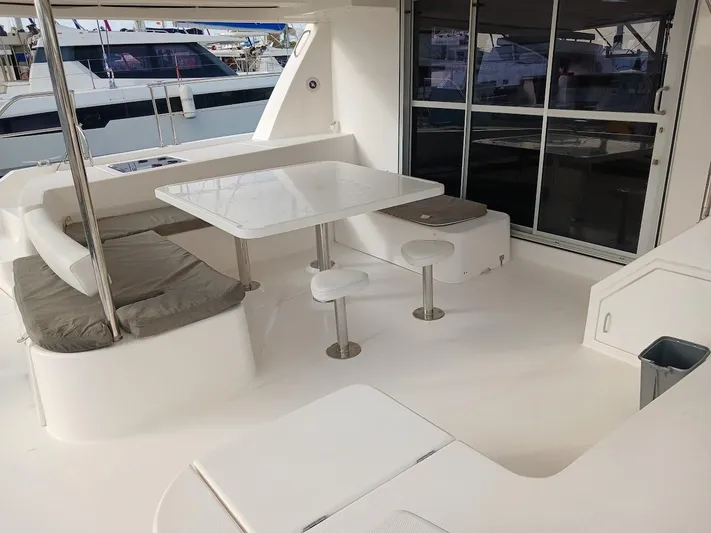 Whimsea II Yacht Photos Pics 2018 Leopard 51 Powercat yacht interior with modern seating and dining area.