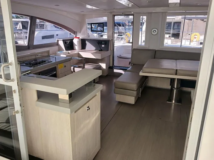Whimsea II Yacht Photos Pics Luxurious interior of 2018 Leopard 51 Powercat yacht with modern kitchen and seating area.