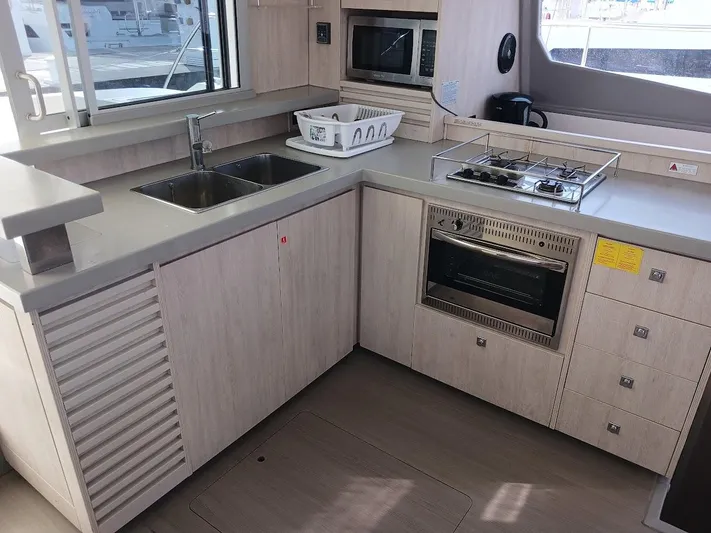 Whimsea II Yacht Photos Pics Modern kitchen in 2018 Leopard 51 Powercat with stove, oven, and sink.