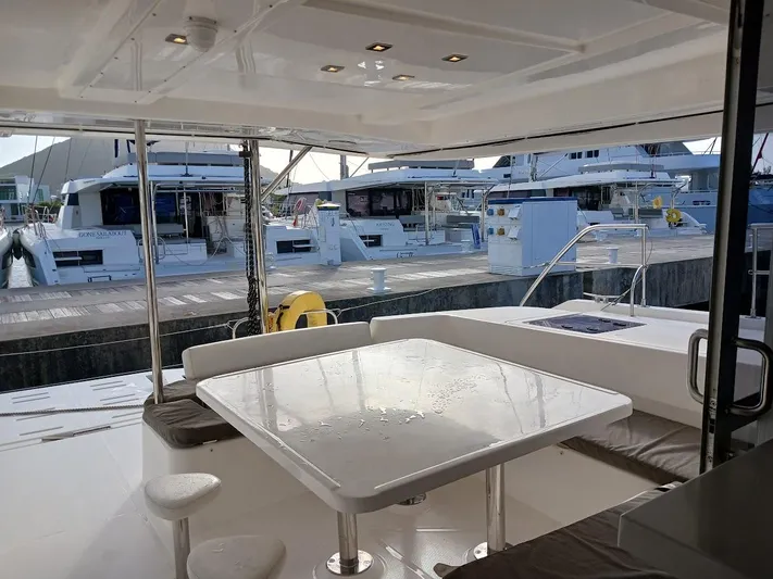 Whimsea II Yacht Photos Pics 2018 Leopard 51 Powercat yacht interior with sleek dining area and marina view.