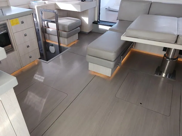 Whimsea II Yacht Photos Pics Modern interior of 2018 Leopard 51 Powercat with sleek seating and stylish flooring.