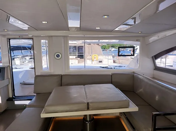 Whimsea II Yacht Photos Pics Interior of 2018 Leopard 51 Powercat yacht with modern seating and large windows.