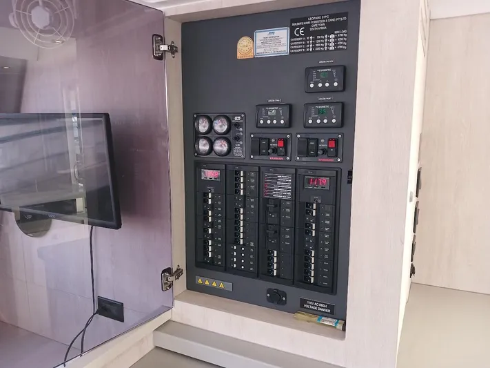 Whimsea II Yacht Photos Pics Electrical panel inside 2018 Leopard 51 Powercat yacht, showcasing control switches and gauges.