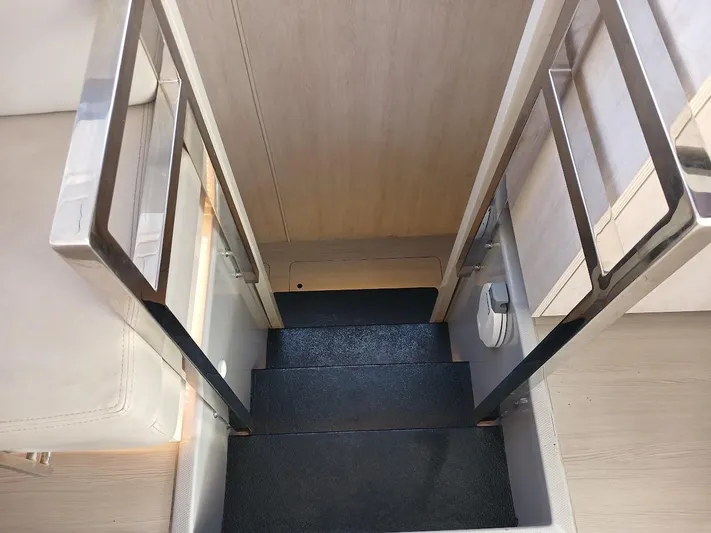 Whimsea II Yacht Photos Pics Staircase on 2018 Leopard 51 Powercat yacht with sleek metal railings.