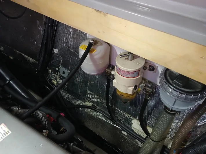 Whimsea II Yacht Photos Pics Engine compartment of 2018 Leopard 51 Powercat with fuel filters and hoses.
