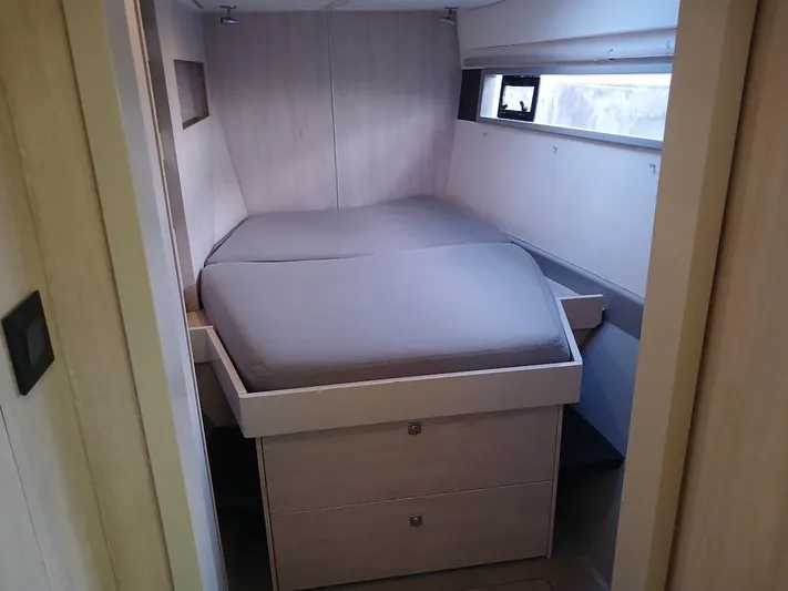 Whimsea II Yacht Photos Pics Interior cabin of 2018 Leopard 51 Powercat with bed and storage drawers.