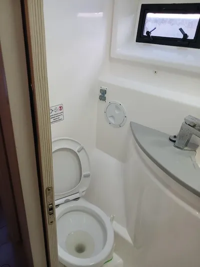 Whimsea II Yacht Photos Pics Bathroom interior of 2018 Leopard 51 Powercat with toilet and sink.