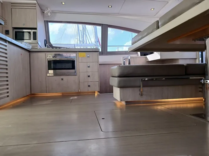 Whimsea II Yacht Photos Pics Interior of 2018 Leopard 51 Powercat yacht with modern kitchen and seating area.