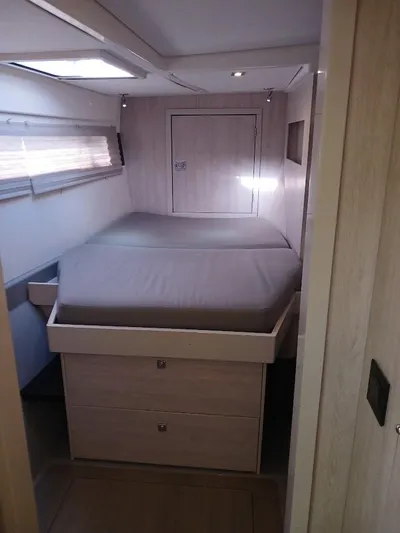 Whimsea II Yacht Photos Pics Interior cabin of 2018 Leopard 51 Powercat with bed and storage drawers.