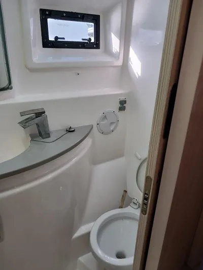 Whimsea II Yacht Photos Pics 2018 Leopard 51 Powercat bathroom with modern fixtures and window.