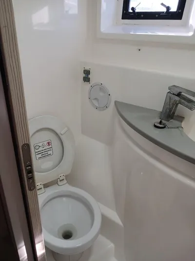 Whimsea II Yacht Photos Pics Compact bathroom in 2018 Leopard 51 Powercat with toilet and sink.