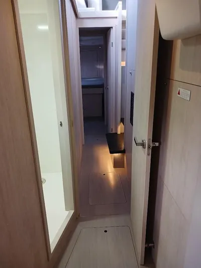 Whimsea II Yacht Photos Pics Interior hallway of 2018 Leopard 51 Powercat yacht, featuring modern wood finishes.