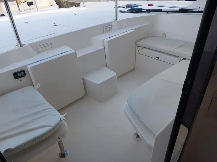 Whimsea II Yacht Photos Pics 2018 Leopard 51 Powercat interior seating area with white cushions.