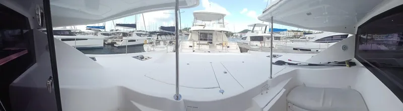 Whimsea II Yacht Photos Pics 2018 Leopard 51 Powercat yacht docked in a marina, surrounded by other boats.