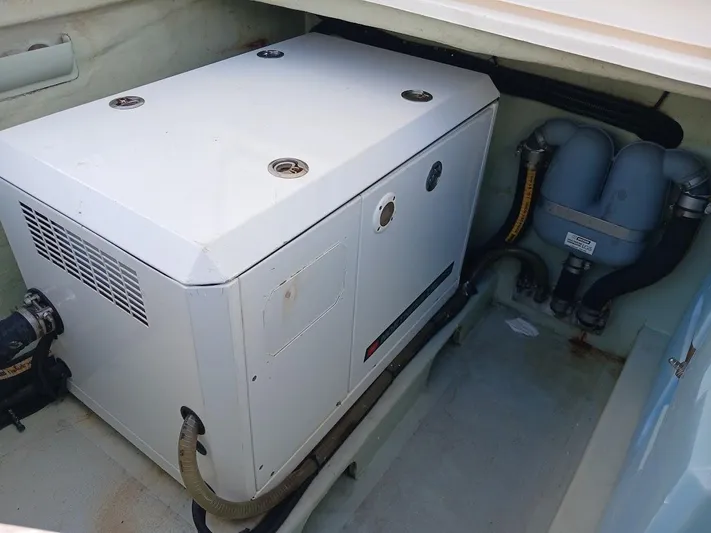 Whimsea II Yacht Photos Pics Engine compartment of 2018 Leopard 51 Powercat with generator and hoses.
