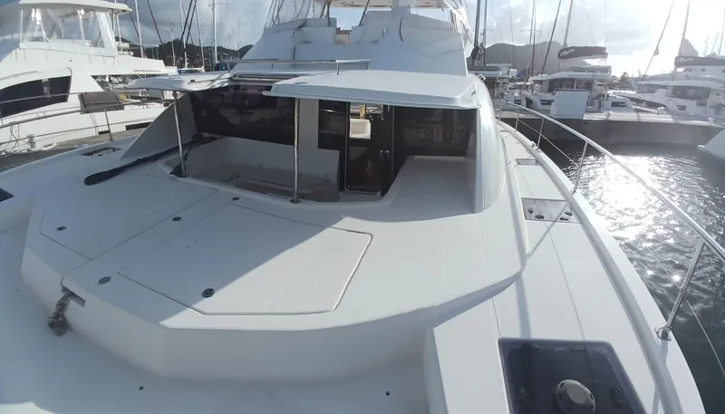 Whimsea II Yacht Photos Pics 2018 Leopard 51 Powercat yacht docked in marina, showcasing sleek design and spacious deck.