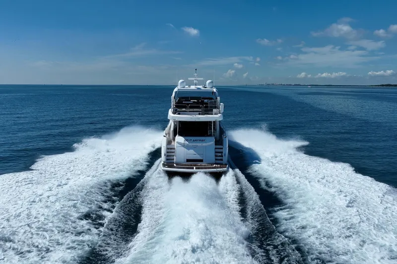 Do It Anyway Yacht Photos Pics Sunseeker 76 Yacht 2018 cruising on open sea, leaving a wake behind.