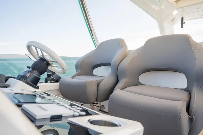 Do It Anyway Yacht Photos Pics Luxurious helm seats and steering wheel on 2018 Sunseeker 76 Yacht.