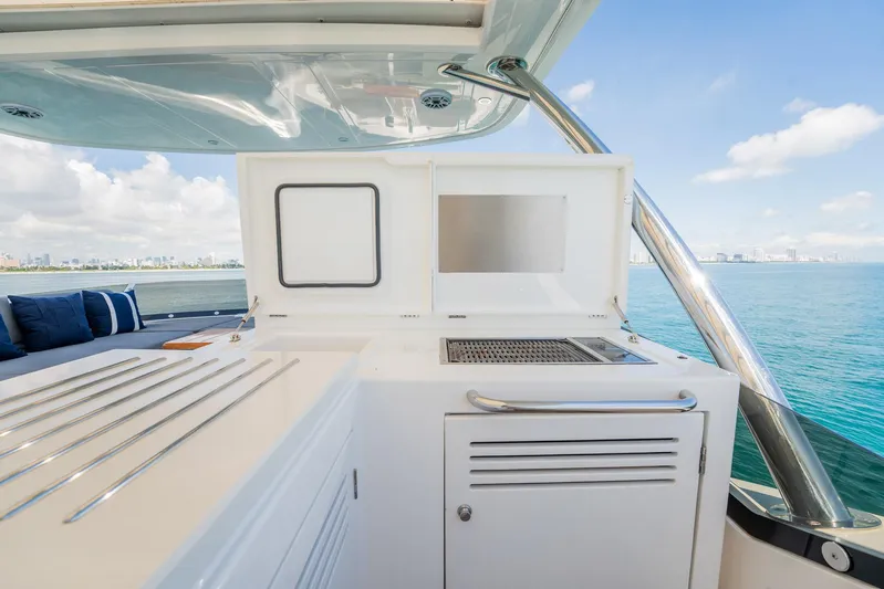 Do It Anyway Yacht Photos Pics Sunseeker 76 Yacht 2018 outdoor kitchen with ocean view and city skyline.