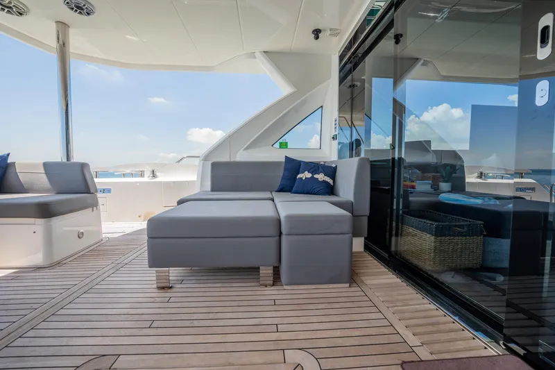 Do It Anyway Yacht Photos Pics Luxurious Sunseeker 76 Yacht 2018 deck with modern seating and ocean view.