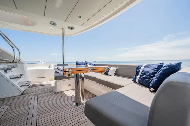 Do It Anyway Yacht Photos Pics Luxurious Sunseeker 76 Yacht 2018 deck with elegant seating and ocean view.
