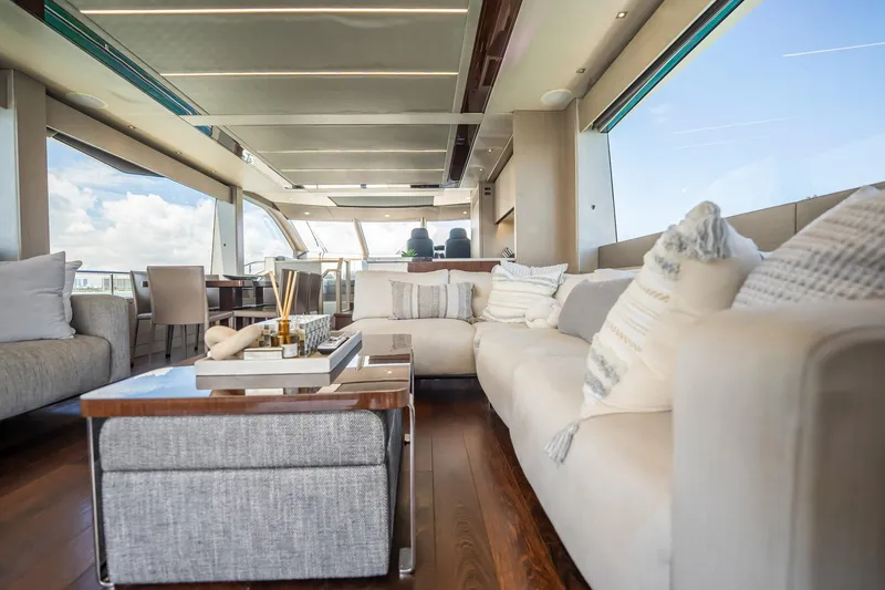 Do It Anyway Yacht Photos Pics Luxurious interior of 2018 Sunseeker 76 Yacht with elegant seating and modern decor.