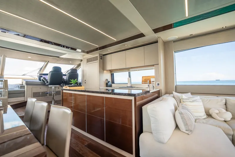 Do It Anyway Yacht Photos Pics Luxurious interior of 2018 Sunseeker 76 Yacht with modern kitchen and seating area.