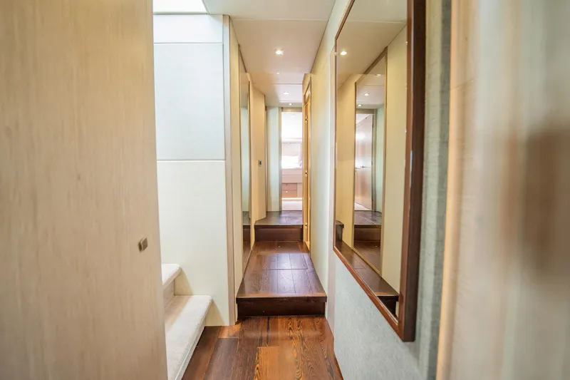 Do It Anyway Yacht Photos Pics Luxurious interior hallway of 2018 Sunseeker 76 Yacht with elegant wood flooring.