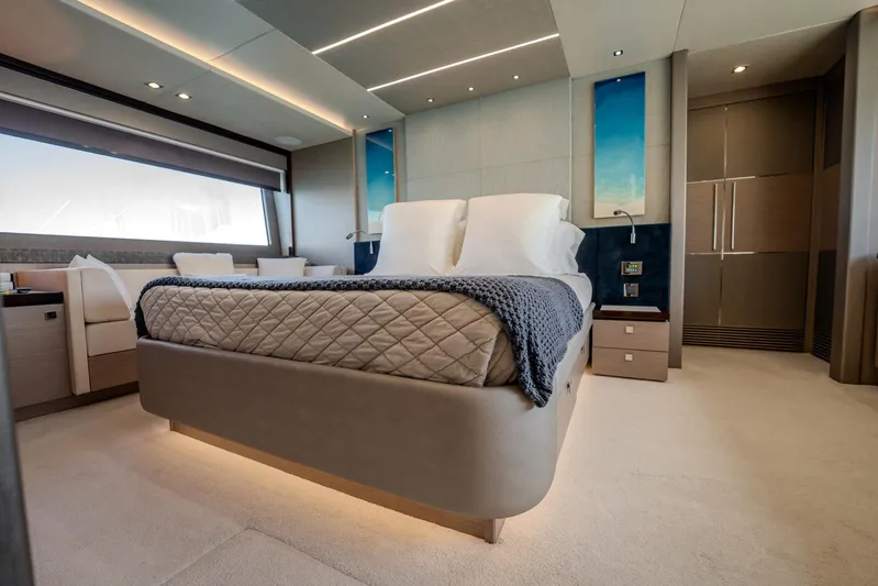 Do It Anyway Yacht Photos Pics Luxurious bedroom interior of 2018 Sunseeker 76 Yacht with modern design and elegant furnishings.