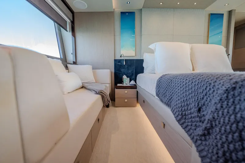 Do It Anyway Yacht Photos Pics Luxurious interior of 2018 Sunseeker 76 Yacht with elegant bedding and modern design.
