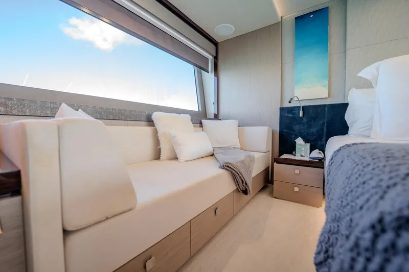 Do It Anyway Yacht Photos Pics Luxurious interior of 2018 Sunseeker 76 Yacht with elegant seating and modern decor.