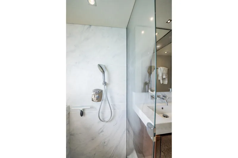 Do It Anyway Yacht Photos Pics Luxurious bathroom in 2018 Sunseeker 76 Yacht with modern shower and sleek design.