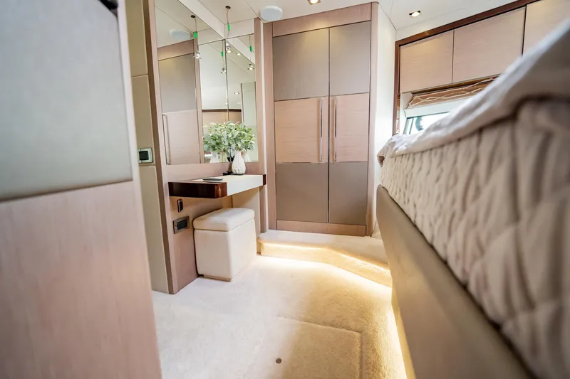 Do It Anyway Yacht Photos Pics Luxurious interior of 2018 Sunseeker 76 Yacht with elegant furnishings and ambient lighting.