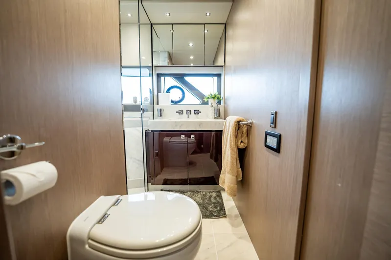 Do It Anyway Yacht Photos Pics Luxurious bathroom interior on 2018 Sunseeker 76 Yacht, featuring modern fixtures and elegant design.