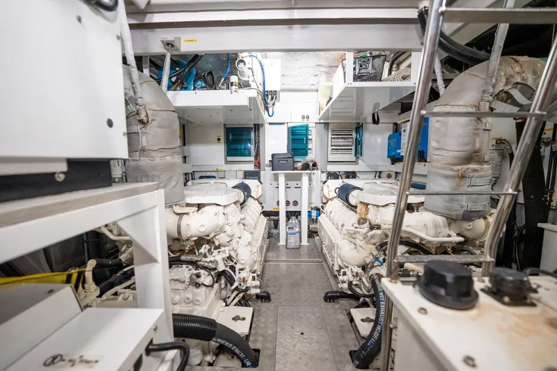 Do It Anyway Yacht Photos Pics Engine room of 2018 Sunseeker 76 Yacht, showcasing dual engines and mechanical systems.