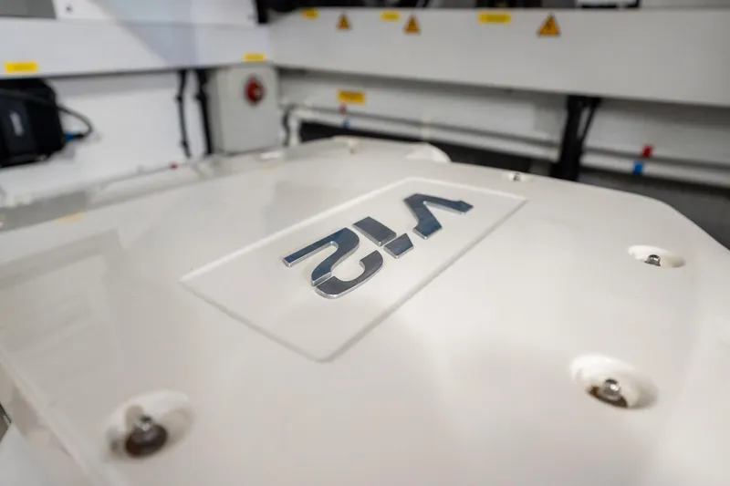 Do It Anyway Yacht Photos Pics Engine room detail of 2018 Sunseeker 76 Yacht, featuring V12 emblem.