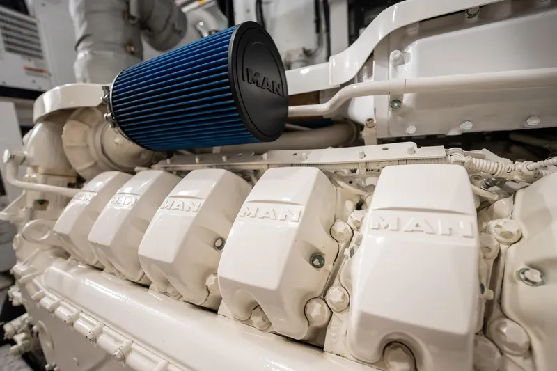 Do It Anyway Yacht Photos Pics Engine of 2018 Sunseeker 76 Yacht with MAN components and blue air filter.