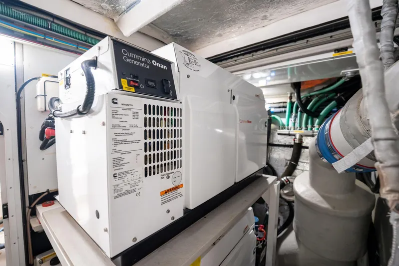 Do It Anyway Yacht Photos Pics Engine room of 2018 Sunseeker 76 Yacht featuring Cummins Onan generator.