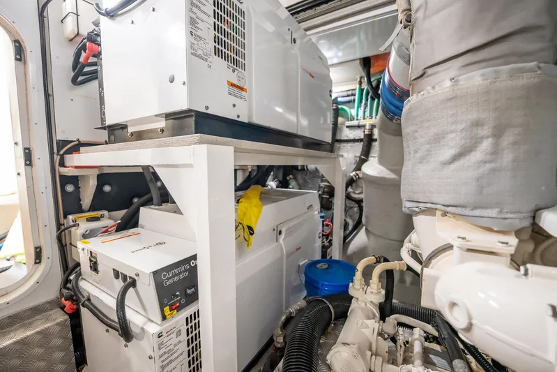 Do It Anyway Yacht Photos Pics Engine room of 2018 Sunseeker 76 Yacht with Cummins Onan generator.