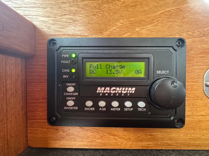 Rafiki Yacht Photos Pics Magnum Energy control panel displaying full charge at 13.5V on a 2000 Nordic Tug 37.
