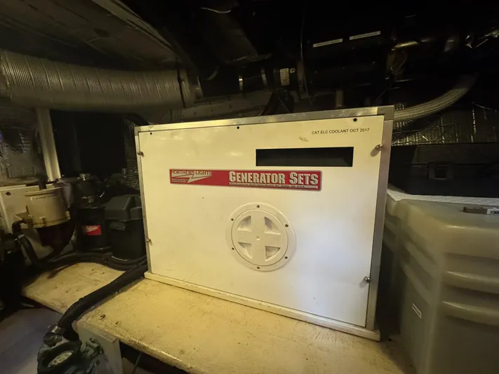 Rafiki Yacht Photos Pics Generator set in Nordic Tug 37 engine room, 2000 model, with visible ventilation and piping.