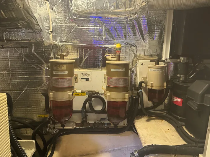 Rafiki Yacht Photos Pics Engine room of a 2000 Nordic Tug 37 with fuel filters and insulation.