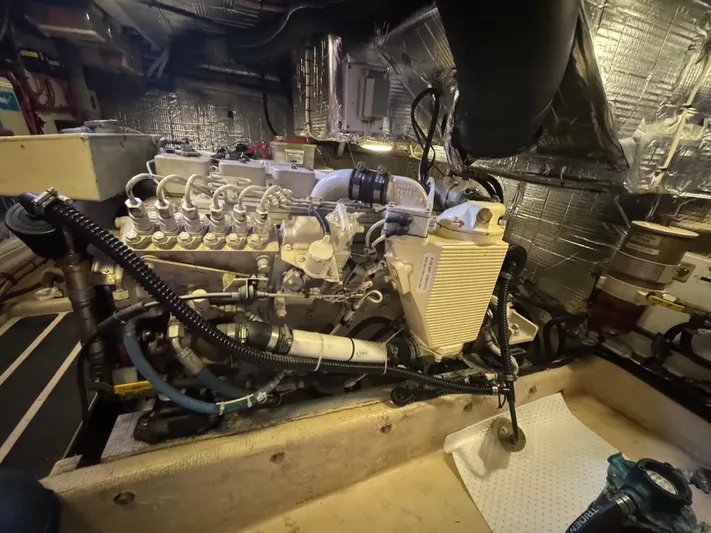 Rafiki Yacht Photos Pics Engine room of a 2000 Nordic Tug 37, showcasing detailed mechanical components.